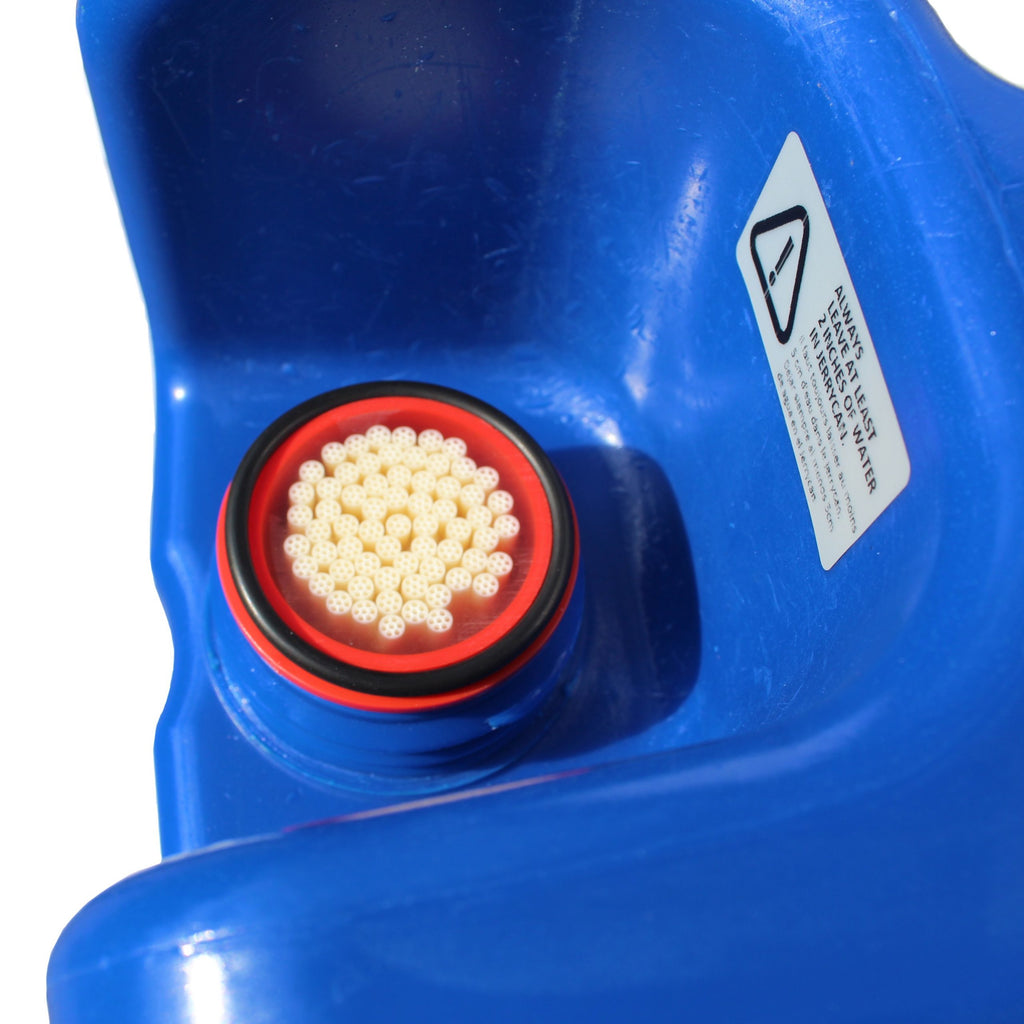 Close-up of a blue Jerrycan with a red filter and warning label on a white background